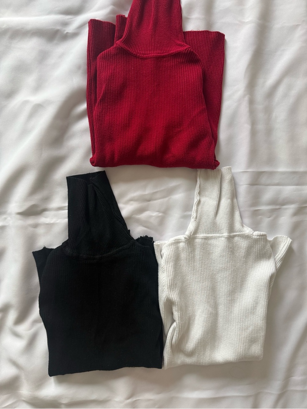 three size S sweaters